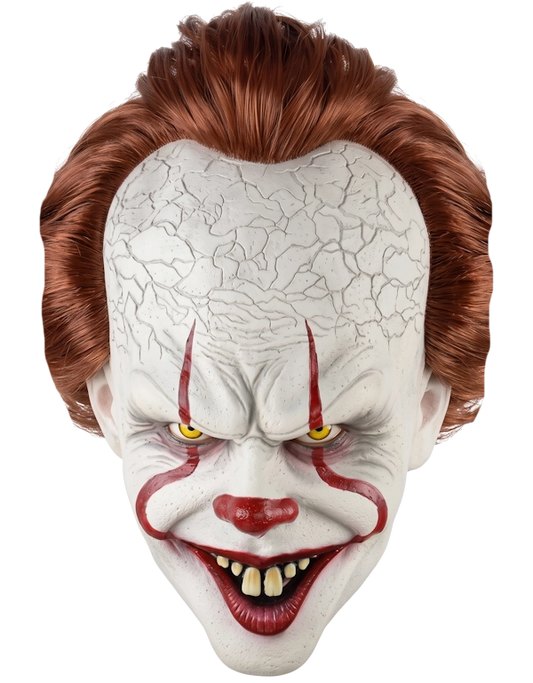 A Pennywise horror clown mask with cracked white skin, red paint details, yellow eyes, and messy auburn hair, shown against a plain white background.