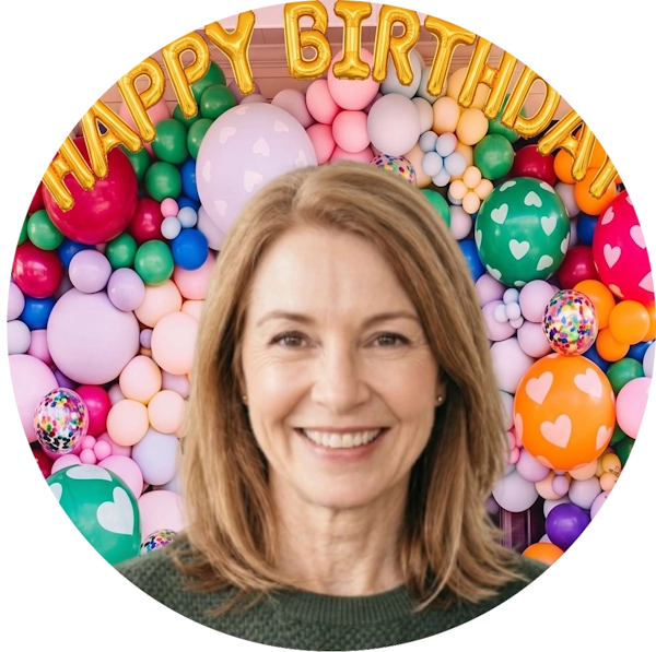 A circular birthday-themed photo backdrop featuring a smiling woman in the foreground, with a colorful balloon arrangement and gold foil balloons spelling 'HAPPY BIRTHDAY' behind her.